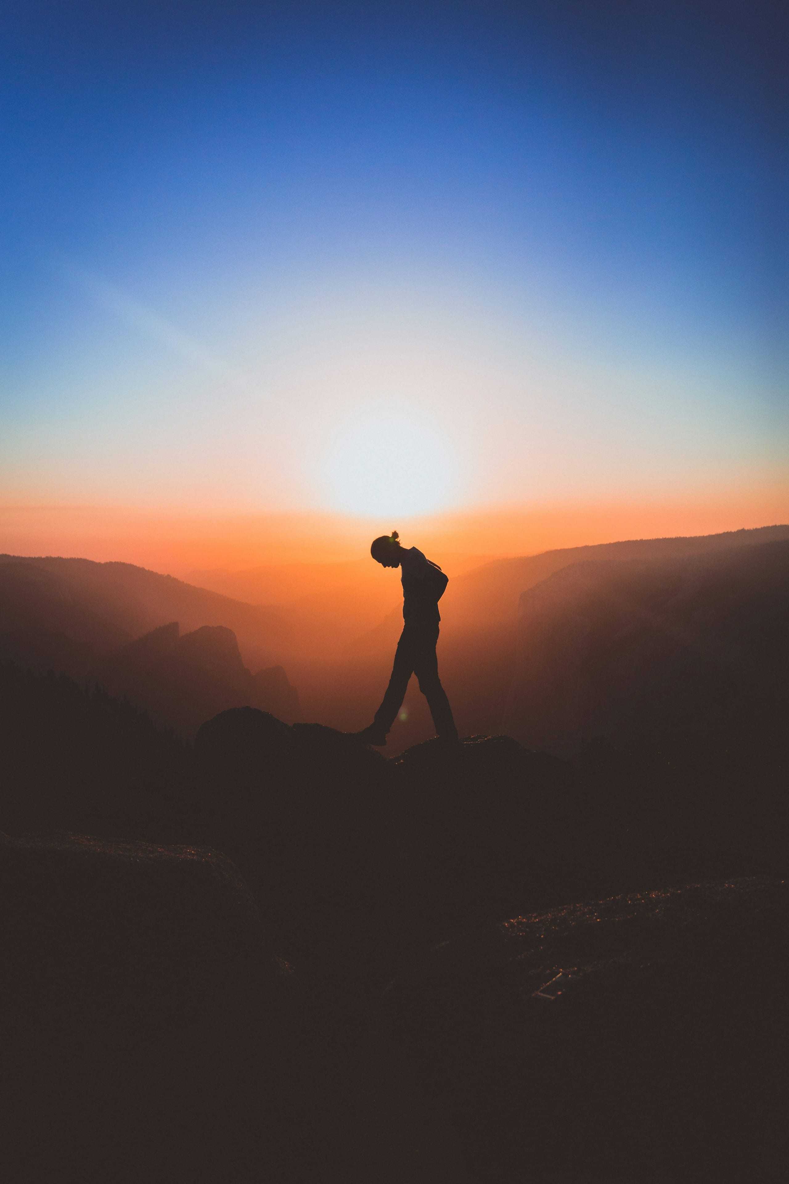 A mountain summit above the clouds at golden hour